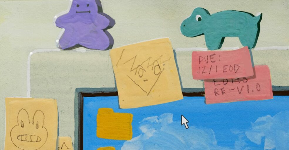 Personal decorations and post-its on a computer in an office.