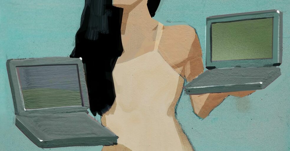 Woman holding laptops as social selling tools.